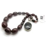 A Cherry Amber Coloured Bead Necklace, of short graduated design; together with a XIX Century banded