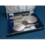 A Hallmarked Silver Mounted Four Piece Dressing Table Set, HCD, Birmingham 1962, each engine