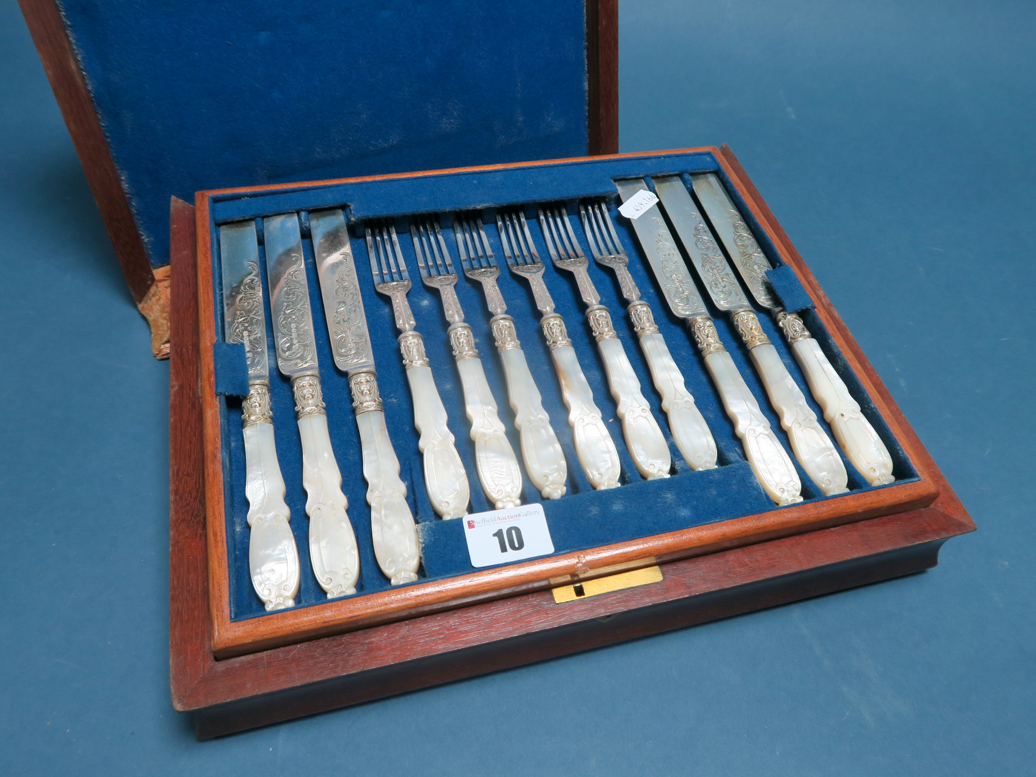 A Decorative Set of Eighteen Mother of Pearl Handled Dessert Knives and Forks, in original fitted