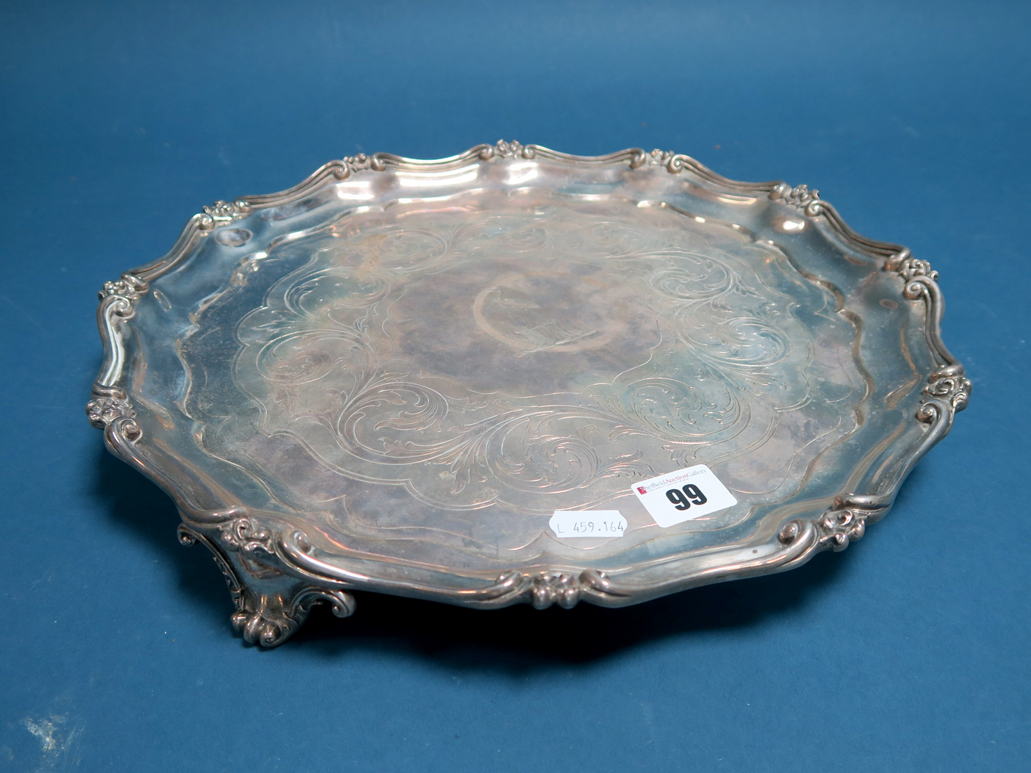 A Hallmarked Silver Salver, Benjamin Smith, London 1840, of shaped circular form with leaf scroll