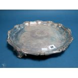 A Hallmarked Silver Salver, Benjamin Smith, London 1840, of shaped circular form with leaf scroll