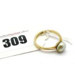 A Single Pearl Set Ring, (8mm) set between plain tapering shoulders, indistinctly stamped.