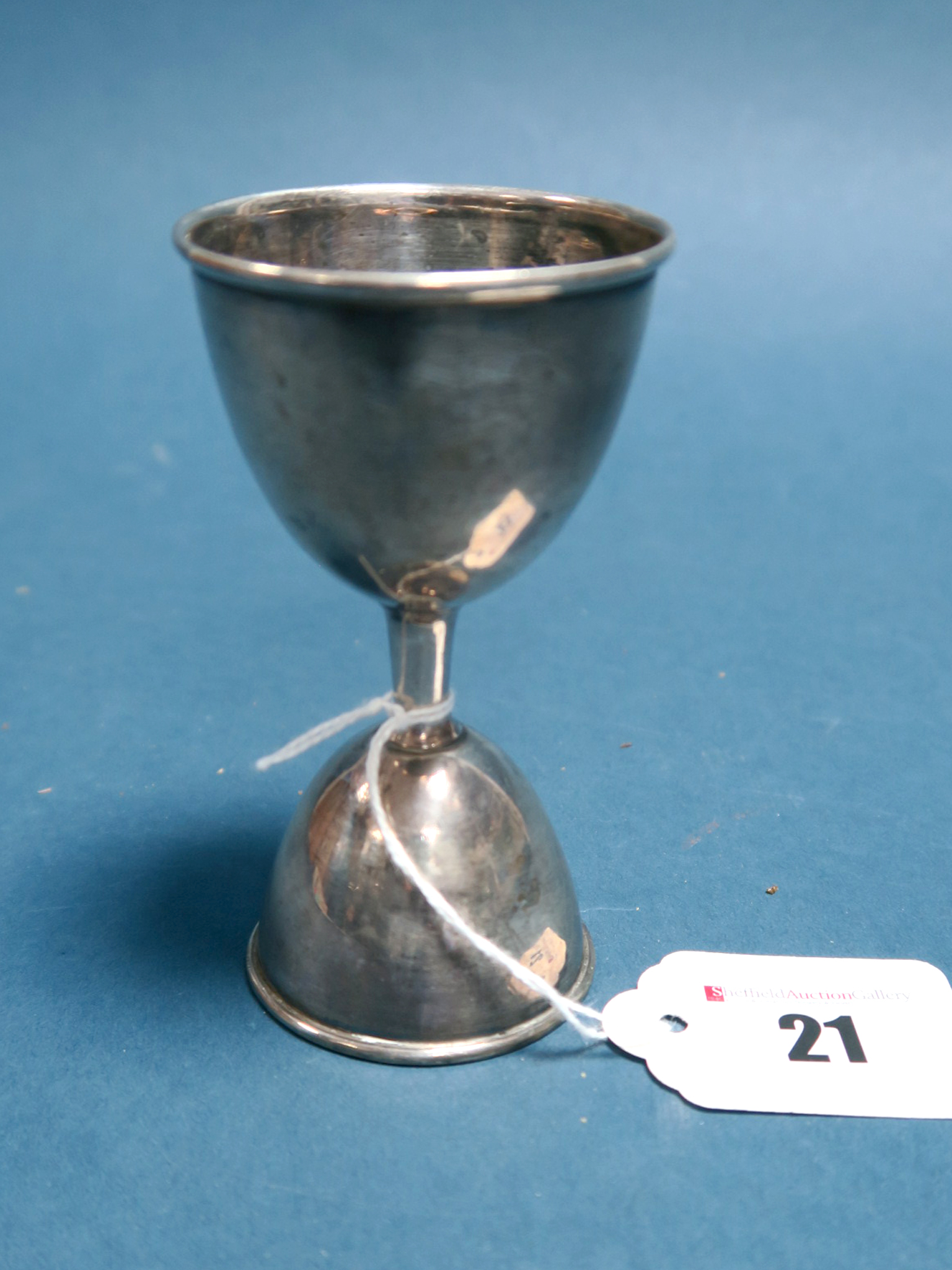 A Hallmarked Silver Measure, L&S, Birmingham 1904, of double egg cup form, 10cm high.