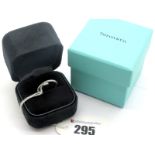 Tiffany & Co; A Slim Platinum Band, with textured detail, in original box with Selfridges & Co (