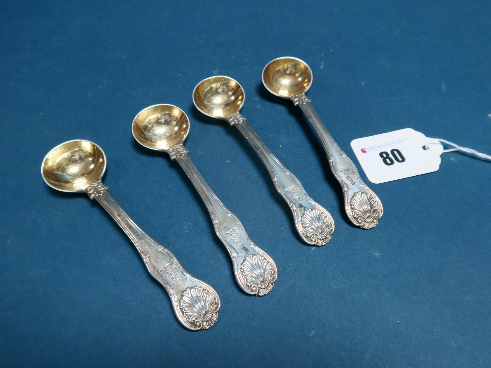 A Set of Four Hallmarked Silver Kings Husk Pattern Salt Spoons, WJ, London 1824, each with gilt