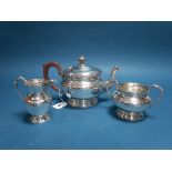 A Hallmarked Silver Three Piece Tea Set, Adie Bros, Birmingham 1935, each with Celtic band style