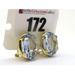 A Pair of Large Single Stone Earrings, each oval four claw set, on Continental hinged back fittings,