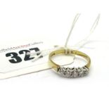 A 9ct Gold Five Stone Diamond Ring, claw set with graduated brilliant cut stones, inscribed ".25".