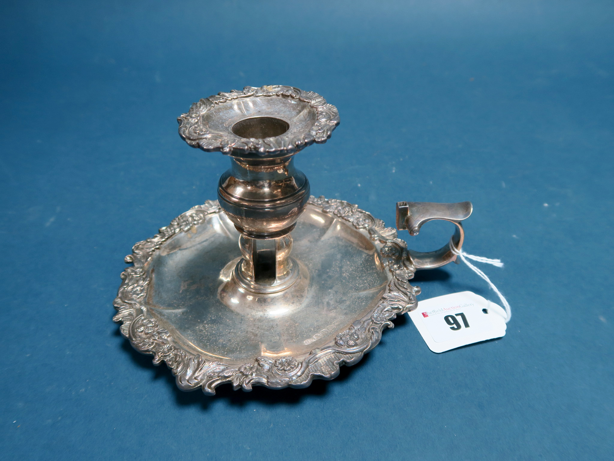 A Hallmarked Silver Chamberstick, Edward Farrell, London 1823, with foliate and leaf scroll border