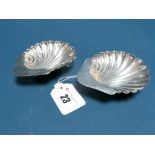 A Pair of Hallmarked Silver Shell Dishes, E.F.HT, London 1893, each raised on three ball feet. (2)