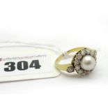 An Edwardian Style Pearl and Diamond Cluster Ring, single pearl set to the centre, within border