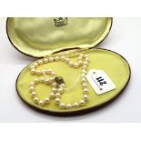 A Uniform Single Strand Pearl Bead Necklace, knotted to diamond set ball clasp. *Ernest Jones (