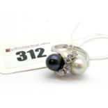 A Pearl and Diamond Set Dress Ring, of crossover design set with one white and one grey pearl spaced