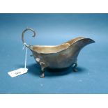 A Hallmarked Silver Sauce Boat, BBSLd, Birmingham 1936, with wavy cut edge and flying scroll handle,
