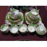 A Coalport Porcelain Part Tea Service, in the green "Batwing" pattern, decorated with sprays of