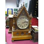 A XIX Century Gothic Style Musical Eight Day Bracket Clock, with a canopy top, turned finials,