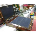 A Victorian Mahogany Writing Slope, with brass strapwork, corner protectors, escutcheon and campaign