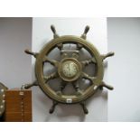 A Brass Bound Oak Ships Wheel, with turned and block supports to eight points, the centre having G.