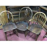 An Ercol Rail Back Easy Chair; a pair of dining chairs similar. (3)