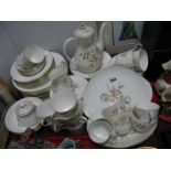 A Royal Doulton "Yorkshire Rose" Pattern Dinner-Tea Service, dinner plates, side plates, bowls, cup,