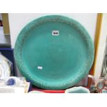 A Studio Pottery Charger, the turquoise ground with a floral and geometric border in black,