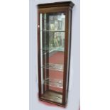 A Late XIX Century Mahogany Shop Display Cabinet, with a glazed door and sides, mirror back,