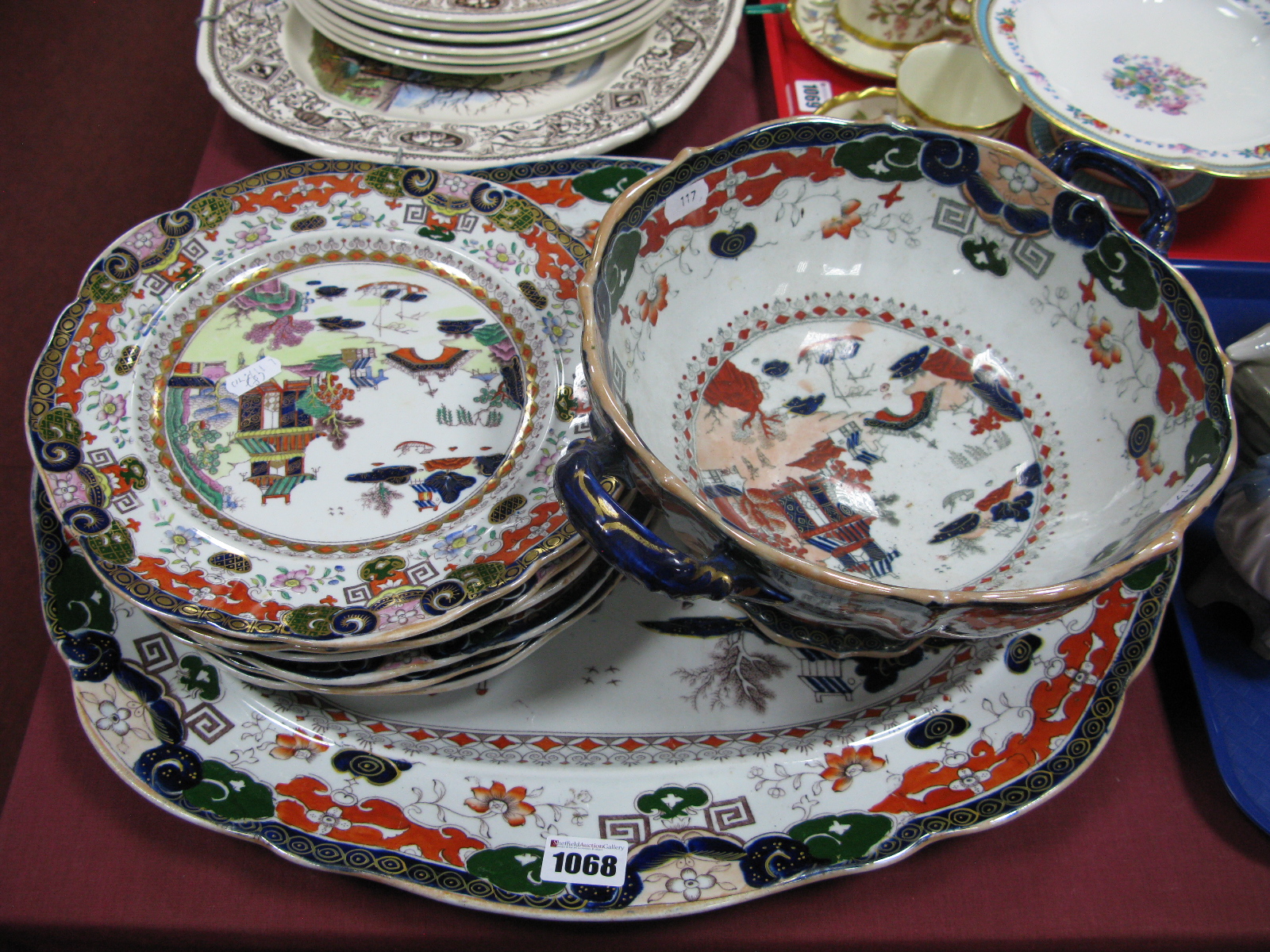 A Mason's Ironstone Matched Part Dinner Service, decorated in colours with a willow pattern, printed