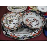 A Mason's Ironstone Matched Part Dinner Service, decorated in colours with a willow pattern, printed