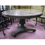 A XIX Century Rosewood Breakfast Table, circular top with hexagonal shaped pedestal, on trefoil