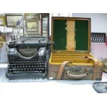 An Olympia Mod 8 Black Typewriter and Vintage Travelling Case, the interior with three oak sections.