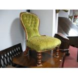 A XIX Century Mahogany Spoon Back Nursing Chair, with a upholstered back and seat, on turned legs.