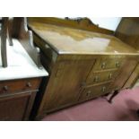 A XX Century Sideboard, with shaped low back, three central drawers, flanking cupboards, on cabriole