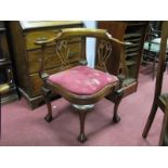 An XVIII Century Style Mahogany Corner Chair, with a shaped top rail, pierced splats, drop in