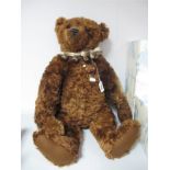 A Modern Jointed Teddy Bear by 'Barron Bears' 'Rocky', approximately 28" high, reddish brown, with