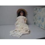 A Bisque Headed German Doll, by Armand Marseille, stamped 390/A7M, sleepy eyes, open mouth with