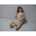 An Early XX Century Bisque Headed Doll, by Armand Marseille of Germany, stamped 390n. Sleepy eyes,