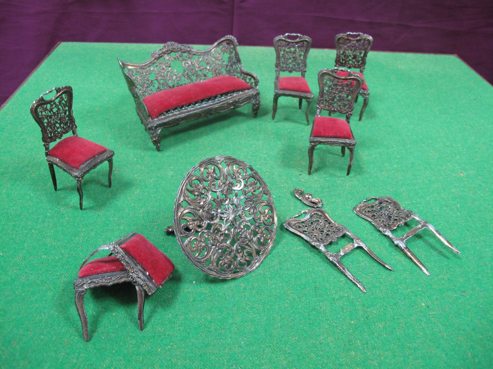 A Small Quantity of Fine Fret Work Metal Dolls House Furniture, made up of settee, six chairs and