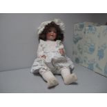 A Bisque Headed German Doll, by Heubach and Koppesdorf, stamped 320 S. Sleepy eyes, open mouth