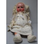 A Large Mid XX Century Composition Baby Doll, sleeping eyes, open mouth with teeth, 65cm high.
