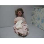 A Bisque Headed Doll, stamped 'Germany-9', sleepy eyes, open mouth with tongue and teeth, Hair