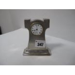 A Silver Bedside Clock, in the Art Nouveau manner with engine turned fascia, and a Swiss made