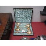 A Highly Decorative Set of Frederick Wilson & Co Dessert Spoons, comprising four serving spoons,