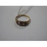 An 18ct Gold Ruby and Diamond Five Stone Ring, graduated claw set, Birmingham 1892.