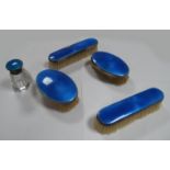 A Set of Four Hallmarked Silver Backed and Blue Enamel Brushes, (damages) together with hallmarked