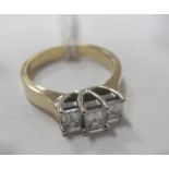 A Modern 18ct Gold Millennium Cut Three Stone Diamond Ring, claw set throughout between plain