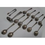 A Set of Twelve Hallmarked Silver Teaspoons; together with a hallmarked silver sifter spoon and a