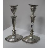 A Pair of Chester Hallmarked Silver Candlesticks, each on navette shape base with removable