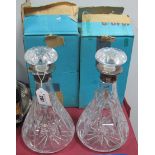 A Pair of Hallmarked Silver Mounted Glass Decanters, with stoppers. (2)