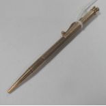 A 9ct Gold Engine Turned Pencil, inscribed "J.O.Mallinson".