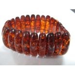 A Modern Amber Coloured Bracelet, elasticated.